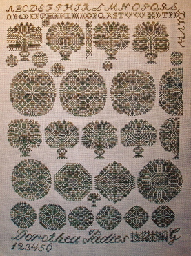 Karen Bugg's gorgeous reproduction. What great fun to stitch and she stitched up soooo fast.. it took about 2 1/2 weeks to stitch her..